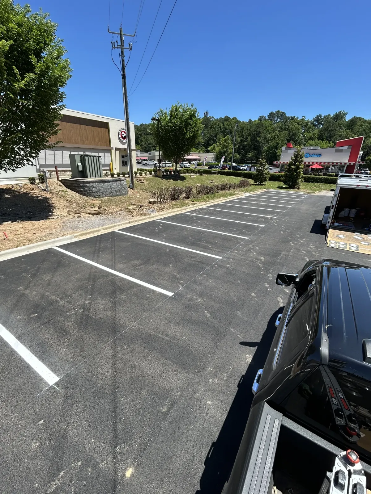 Retail parking lot after BAR Striping laid out fresh white stalls
